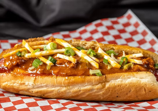 The Chilly Hotdog - All-beef hotdog topped with our signature chili, cheese, and onions